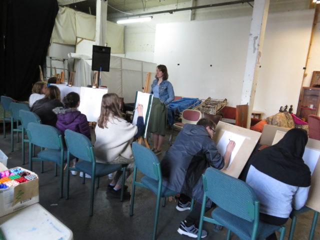 young people learning drawing