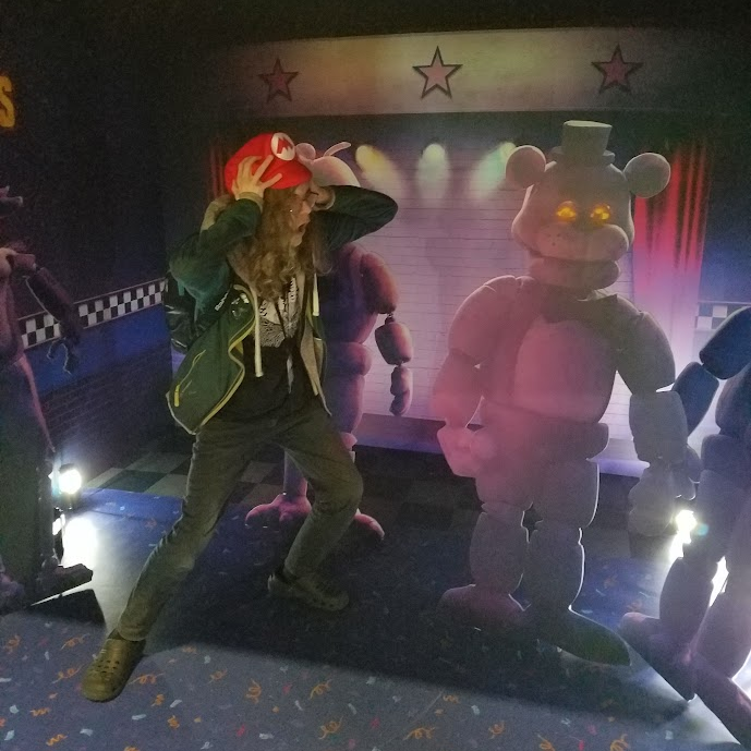 Jago meets a cardboard cutout of Freddie Fazbear