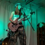 Evie singing at the festival