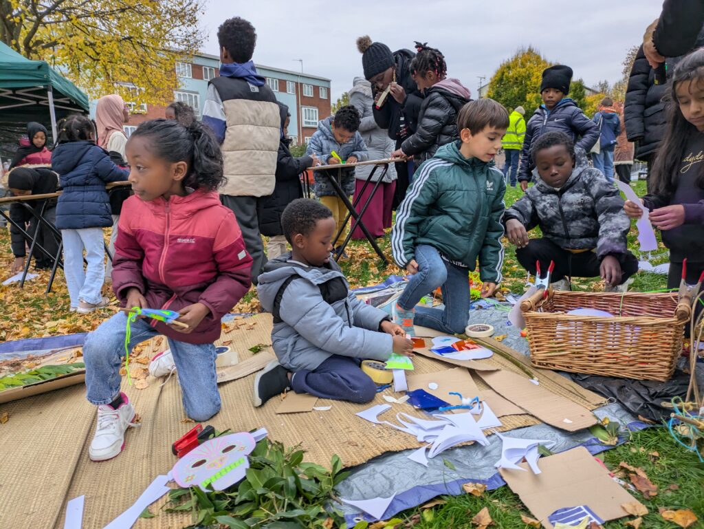 Children making masks in New Hope Park